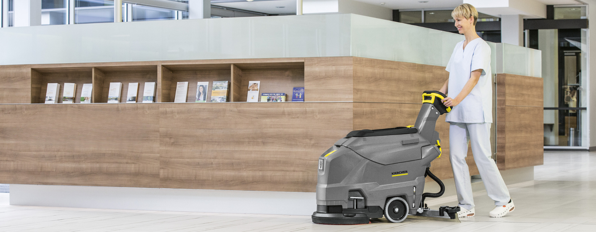 woman using floor care equipment